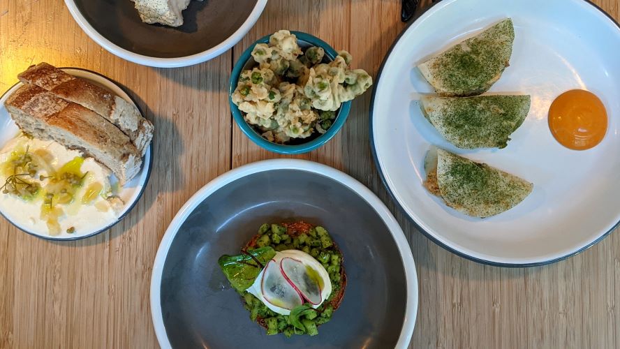 Oleg Pelmeni's mackerel tacos (right), pea tempura (top) and draniki (bottom)